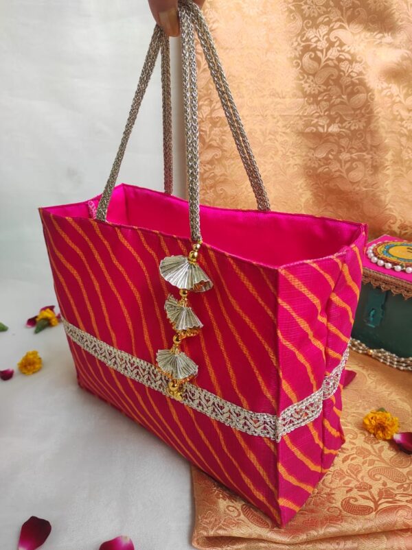 Lahariya Gifting Bags featuring vibrant wave-like patterns, perfect for adding a touch of elegance to your gifts. Sized at 10*8*4 inches, these bags are versatile and spacious, ideal for weddings, festivals, and special occasions