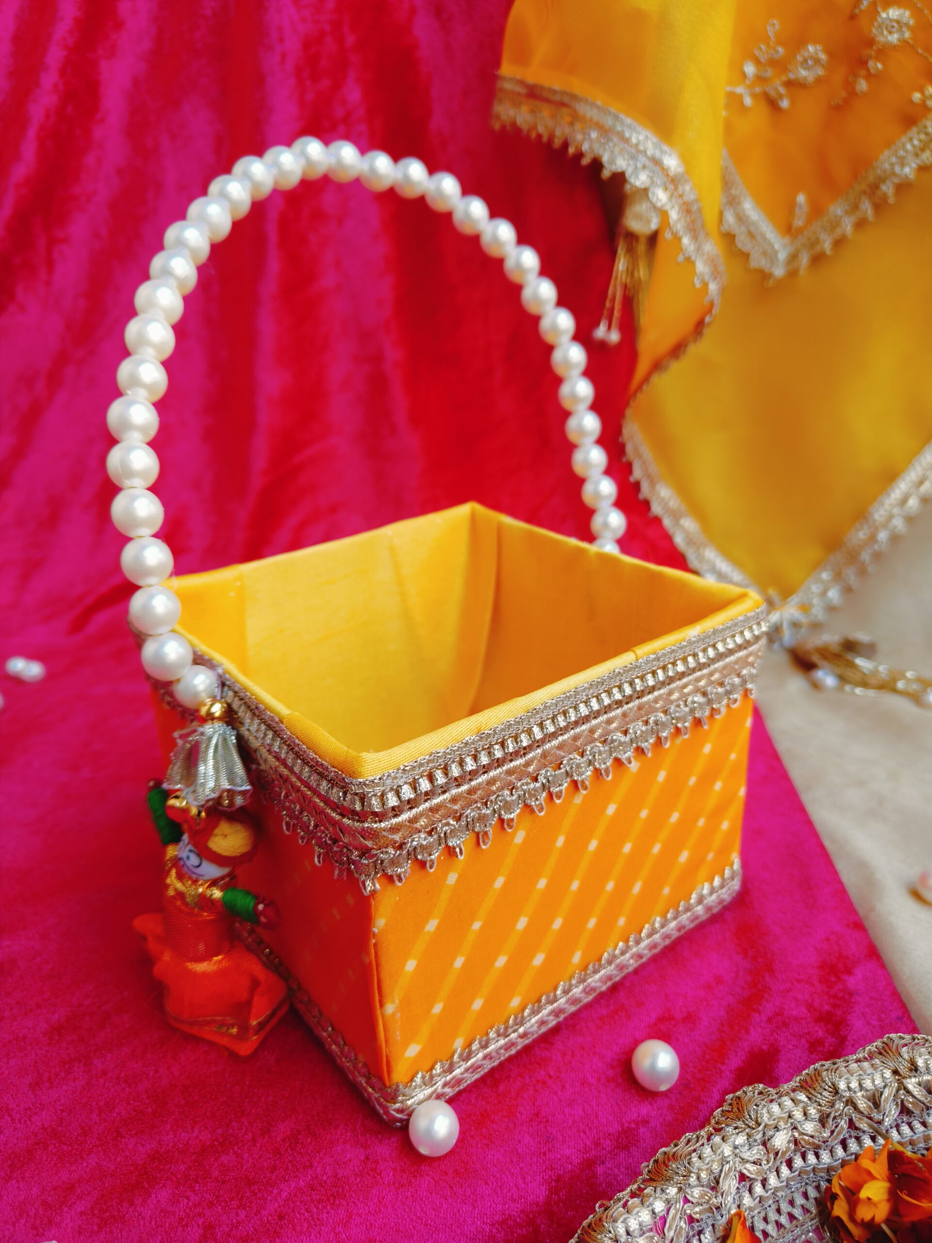 Rajasthani traditional Mothra design Basket with pearl handle, measuring 5 by 5 by 4 inches, ideal for Holi, Gangaur, and Teej festivals as gifting or hamper. Richly adorned with intricate motifs, perfect for adding cultural charm to celebrations.