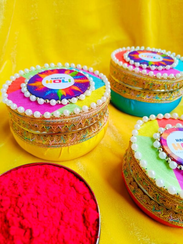 "A vibrant Multi-colored round shape box designed for Holi, with an approximate capacity of 250 grams.