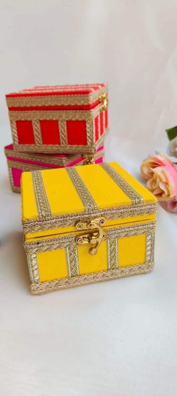 A meticulously handcrafted 4x4x5 inch hamper box with an elegant design, ideal for gifting jewelry and small keepsakes. The box is adorned with intricate details, showcasing superior craftsmanship and a luxurious finish.