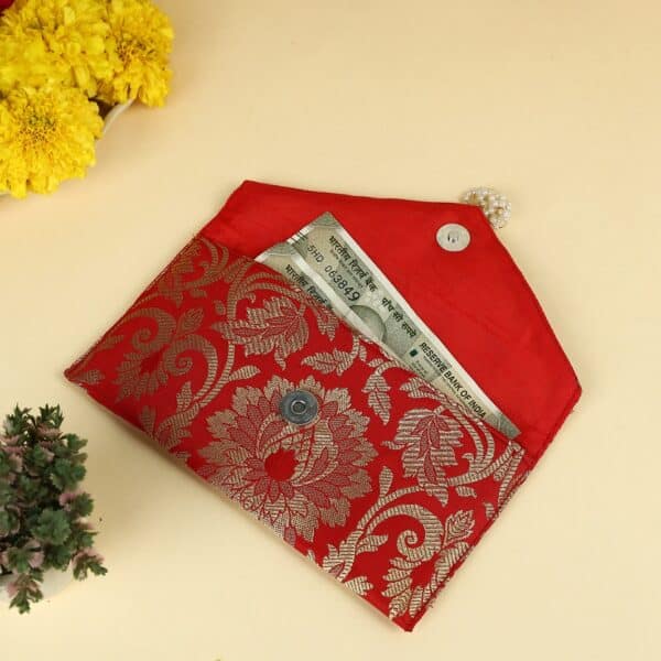 Traditional Indian shagun envelopes featuring intricate embroidery and modern design elements