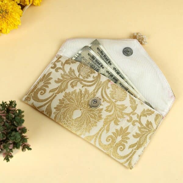 Traditional Indian shagun envelopes featuring intricate embroidery and modern design elements